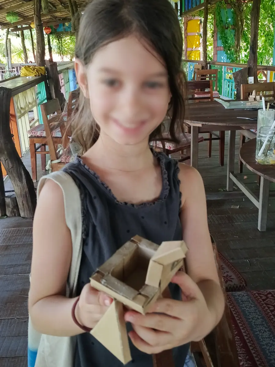 Young toymaker with Bird Bus